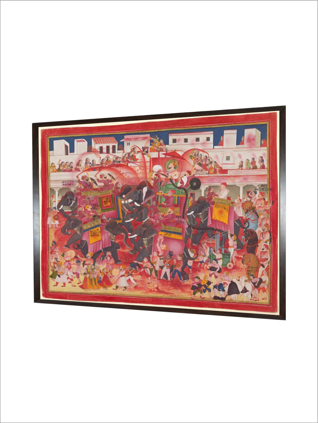 Maharao Ram Singh II of Kotah and companions playing Holi on elephants in a street